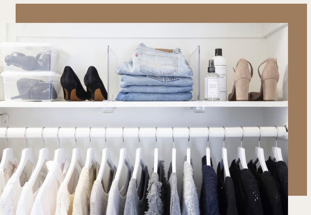perfectly organized home closet with shoes, pants, and blouses on hangers