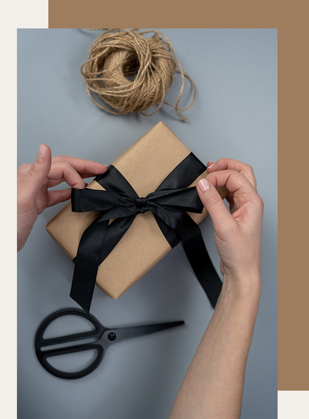woman gift wrapping a box